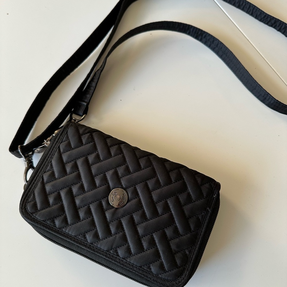Lug Quickstep organizer black quilted crossbody wallet.